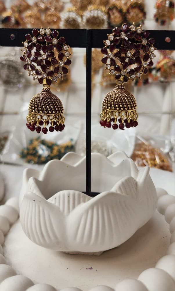Mehroon stone copper base Jhumka (Medium size), photographed against a plain background