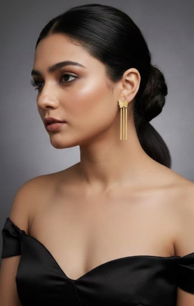 Butterfly Inspired Anti-tarnish Golden Earing, photographed against a plain background