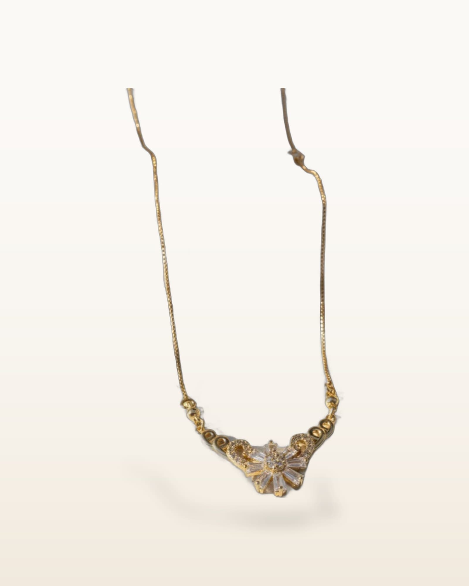 Floral Zircon Pendent, photographed against a plain background