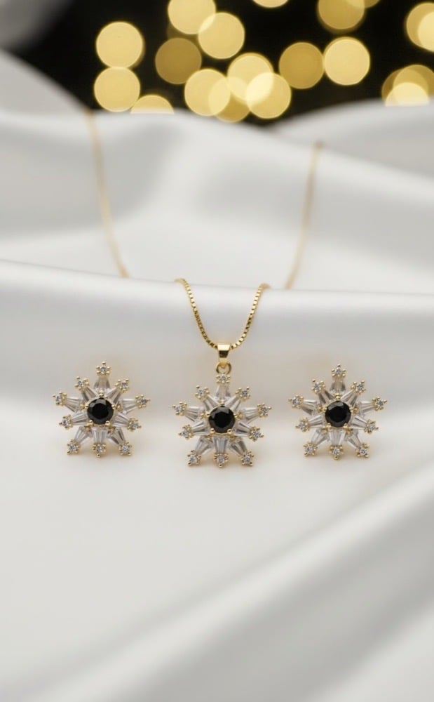 Snowflake zircon pendant and earring set in black