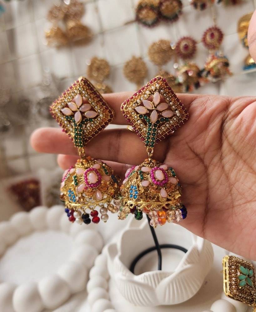 Premium Rajwari (milky multi-stone) Jhumki Earrings, photographed against a plain background