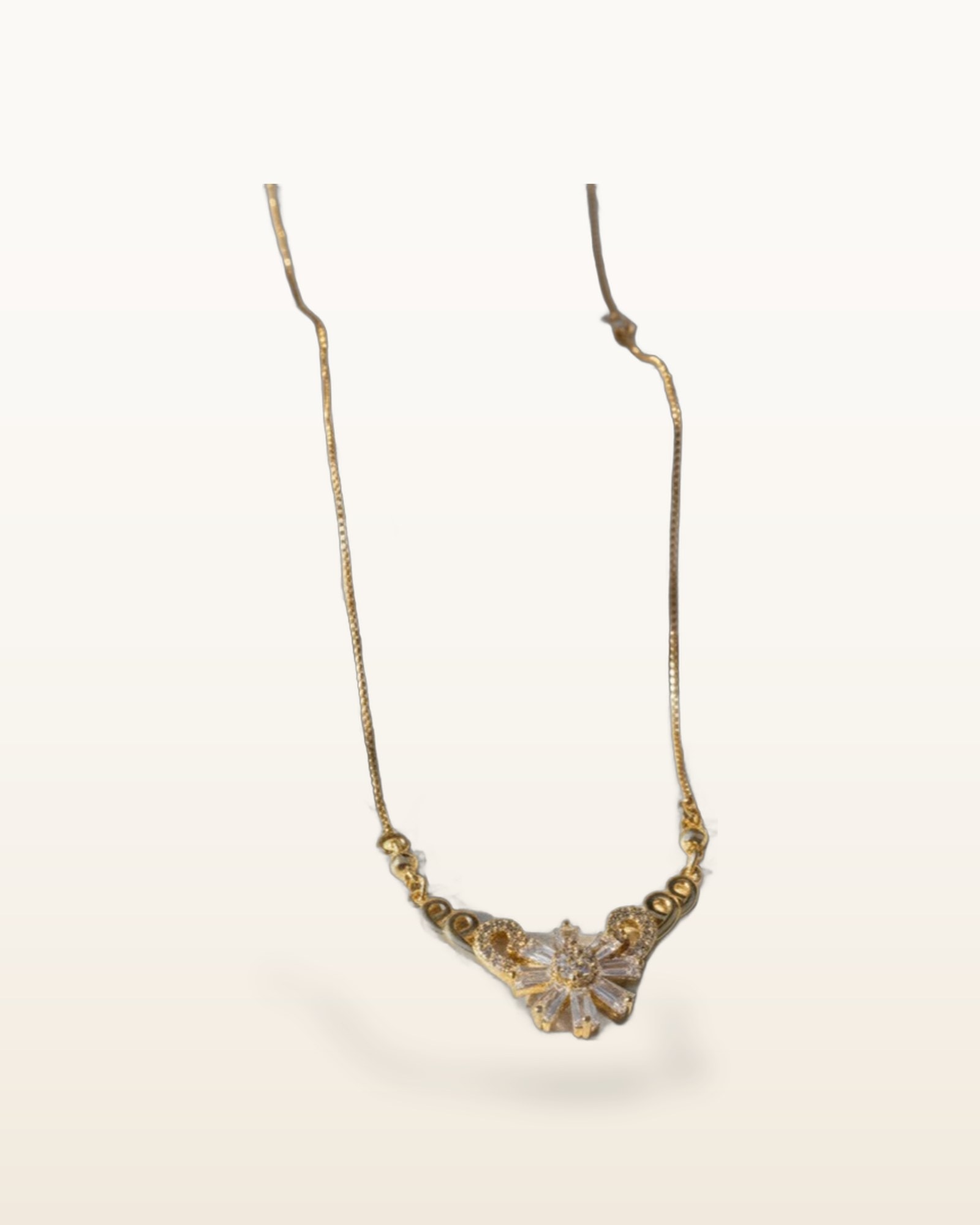 Floral Zircon Pendent, photographed against a plain background